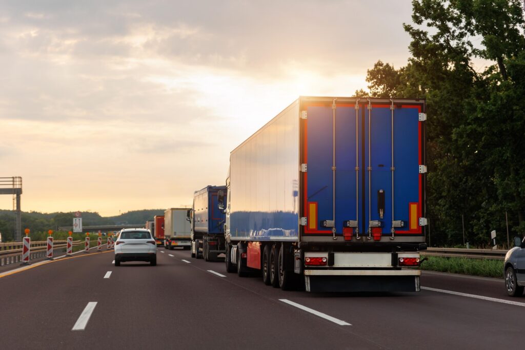 Heavy truck traffic on a Detroit highway illustrating common causes of truck accidents such as congestion and driver fatigue.
