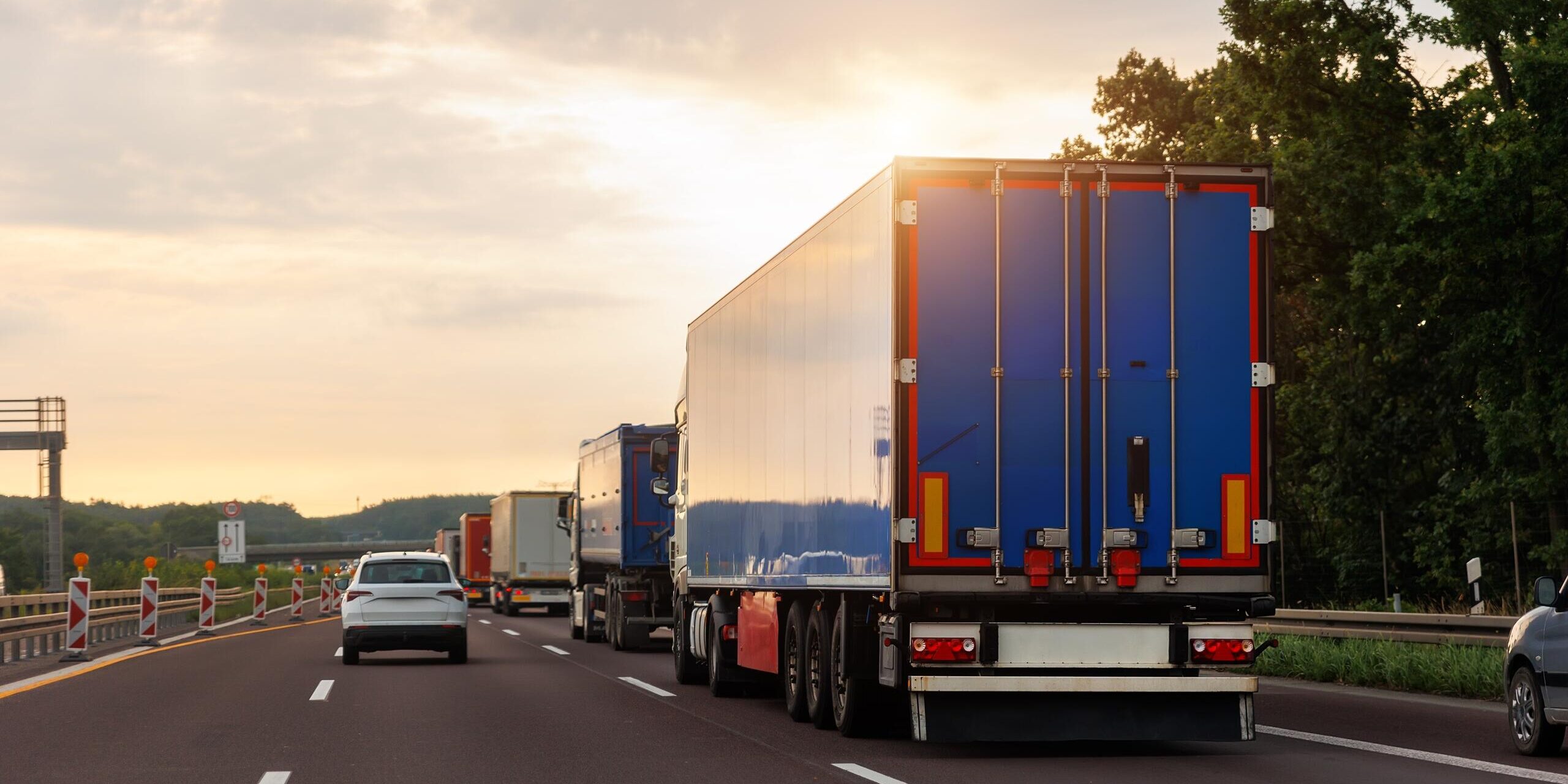 Heavy truck traffic on a Detroit highway illustrating common causes of truck accidents such as congestion and driver fatigue.