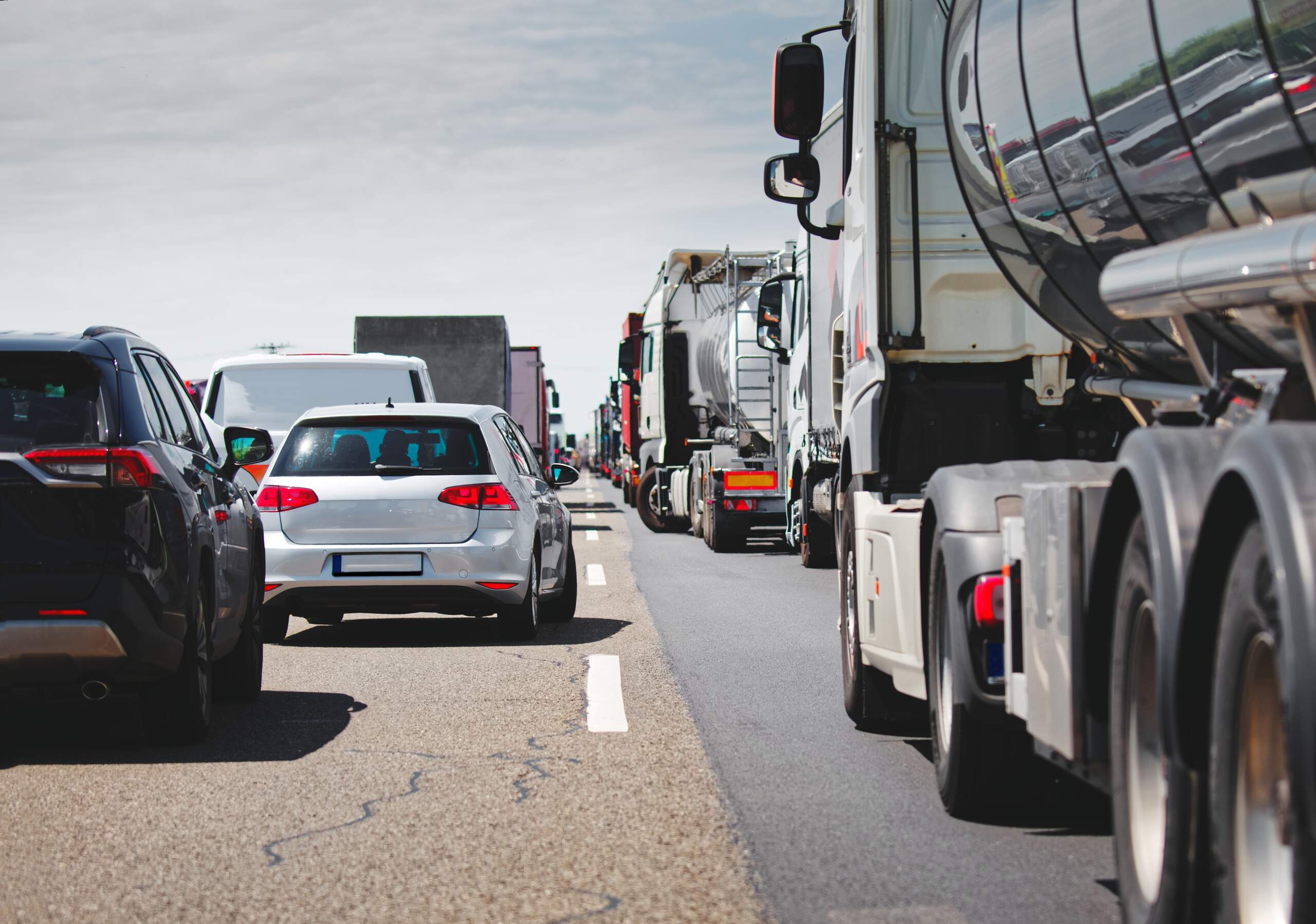 Traffic congestion involving multiple commercial trucks and cars in Detroit, a frequent factor in truck accidents.