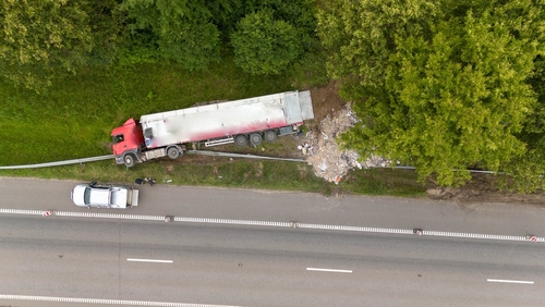 Overturned semi-truck off Detroit highway represented by a Detroit truck accident lawyer