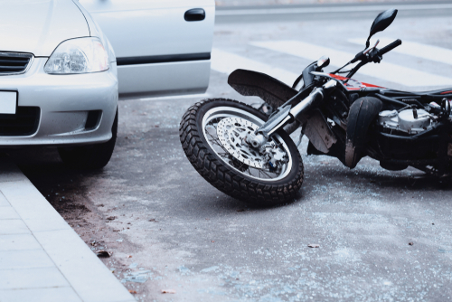 Michigan motorcycle accident lawyer image of motorcycle collision with car showing accident scene
