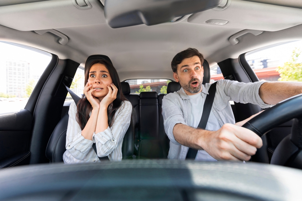 Oak Park rideshare accident lawyer image of driver and passenger reacting to sudden crash inside vehicle