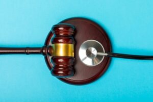 Michigan personal injury attorney image of gavel and stethoscope symbolizing legal and medical aspects of injury cases